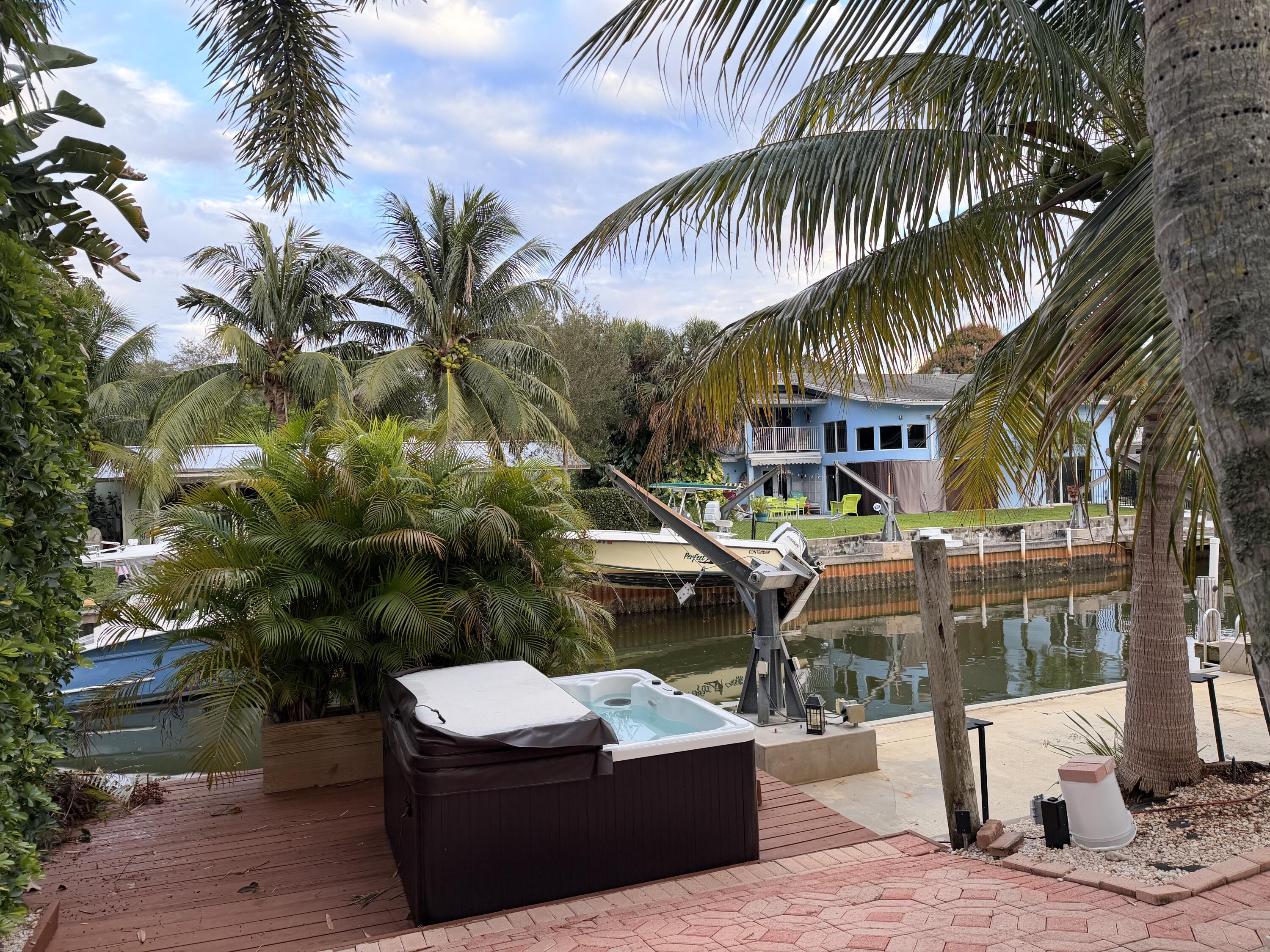 18150 Perigon Way Jupiter, FL 33458 - Photo 57 of 57 a house with palm tree in front of it