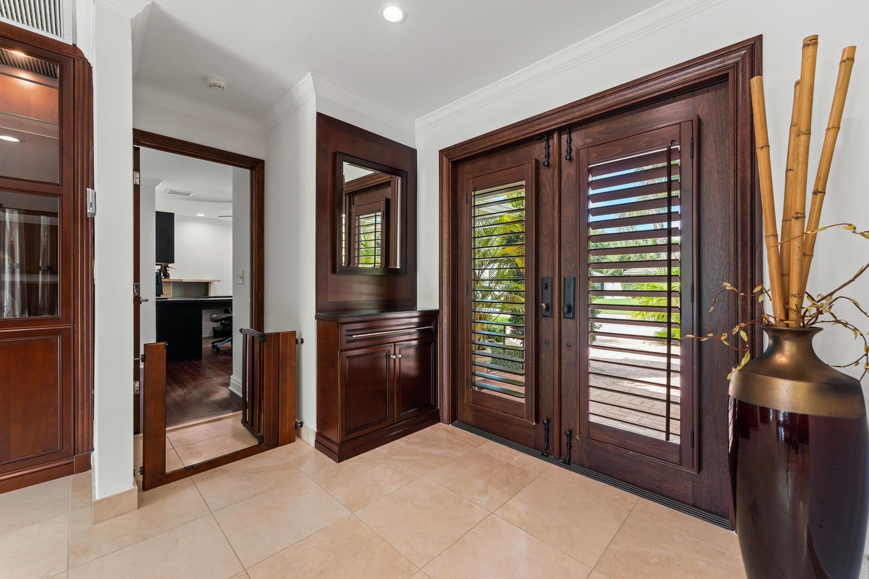 18150 Perigon Way Jupiter, FL 33458 - Photo 7 of 57 a view of a hallway with interior of the house