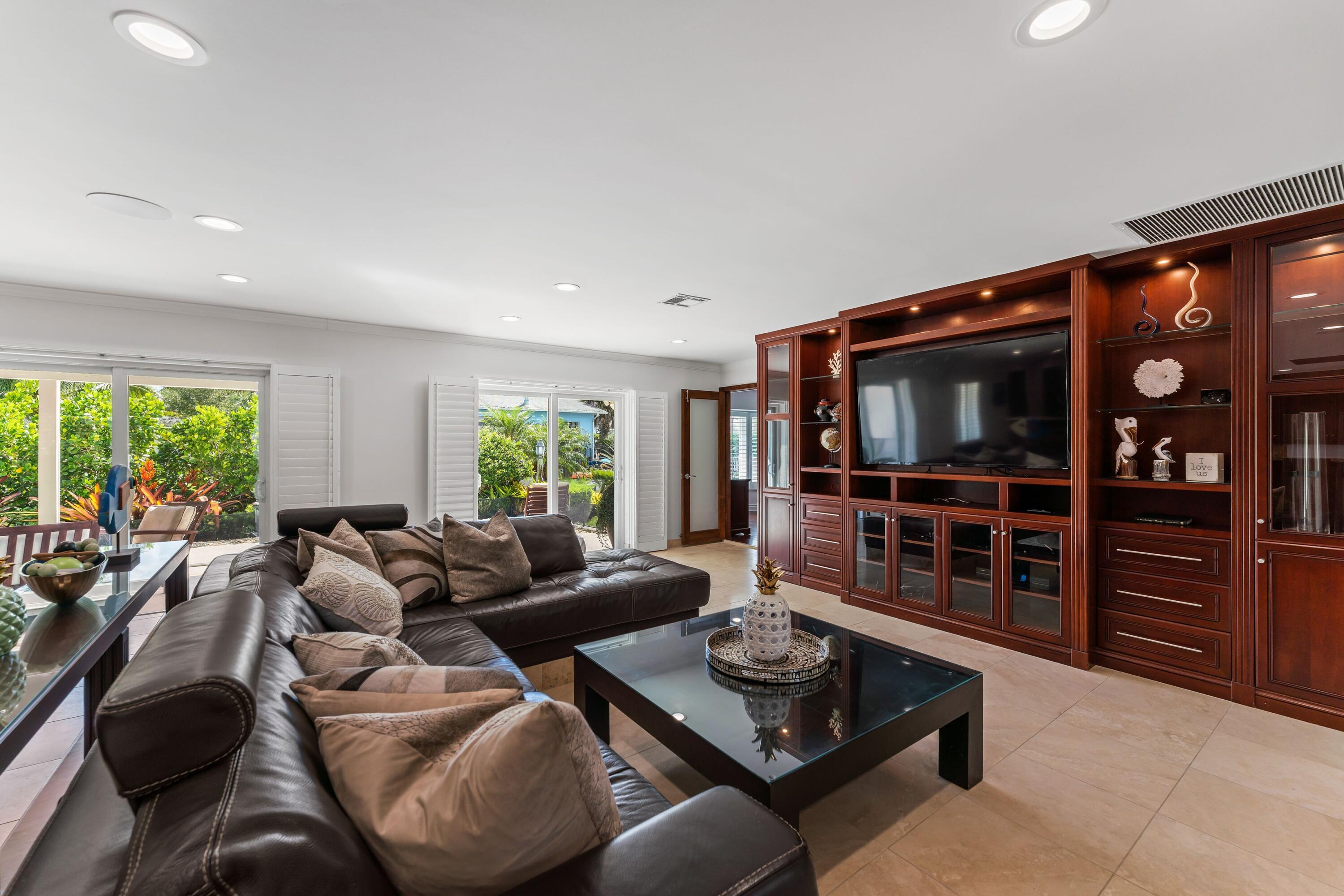 18150 Perigon Way Jupiter, FL 33458 - Photo 9 of 57 a living room with furniture and a flat screen tv