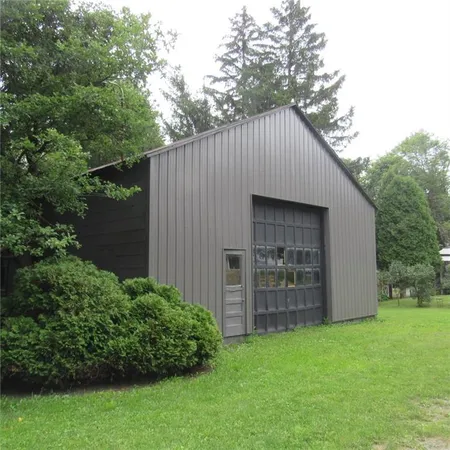 a backyard of a house with lots of green space