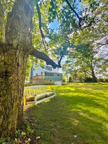 a view of an swimming pool with an outdoor space and seating area
