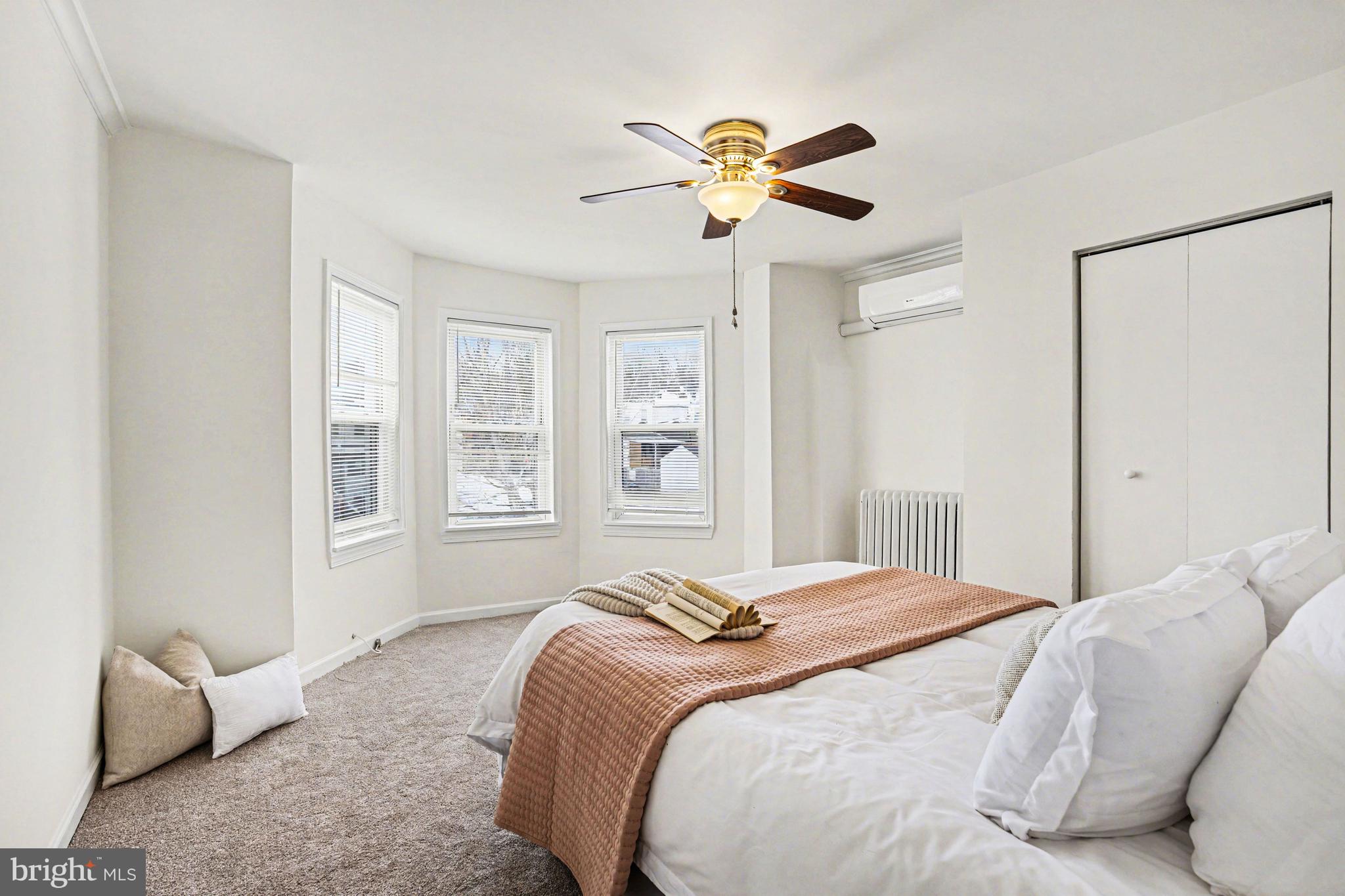 3616 Keystone Avenue Baltimore, MD 21211 - Photo 18 of 26 a bedroom with a large bed and a window