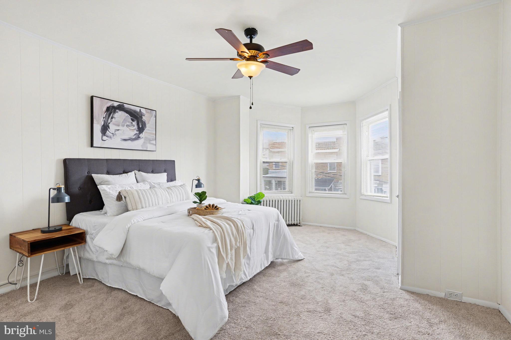 3616 Keystone Avenue Baltimore, MD 21211 - Photo 5 of 26 a bedroom with a bed and window