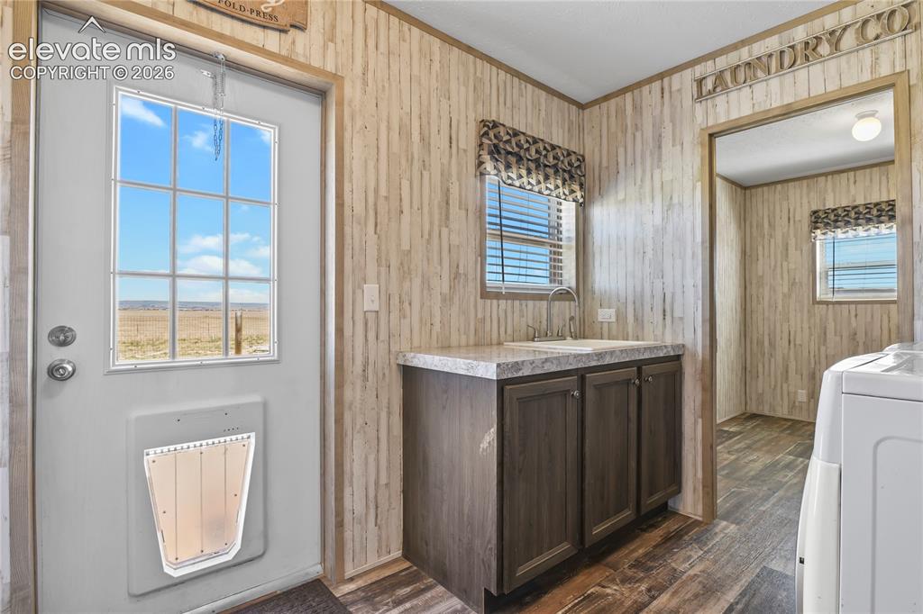 22280 Jones Road Peyton, CO 80831 - Photo 30 of 47 a bathroom with a sink mirror and a bathtub