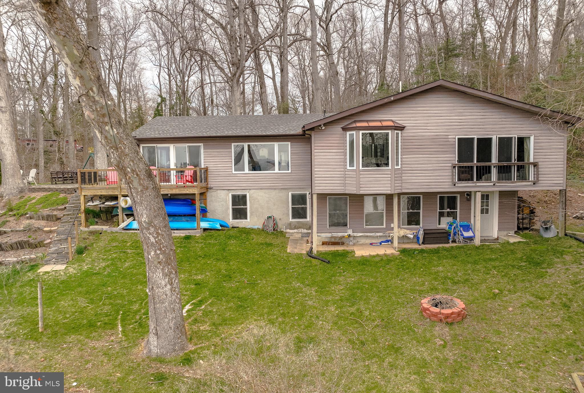 4185 Hance Road Port Republic, MD 20676 - Photo 58 of 62 Firepit creekside! Shed, plenty of parking area