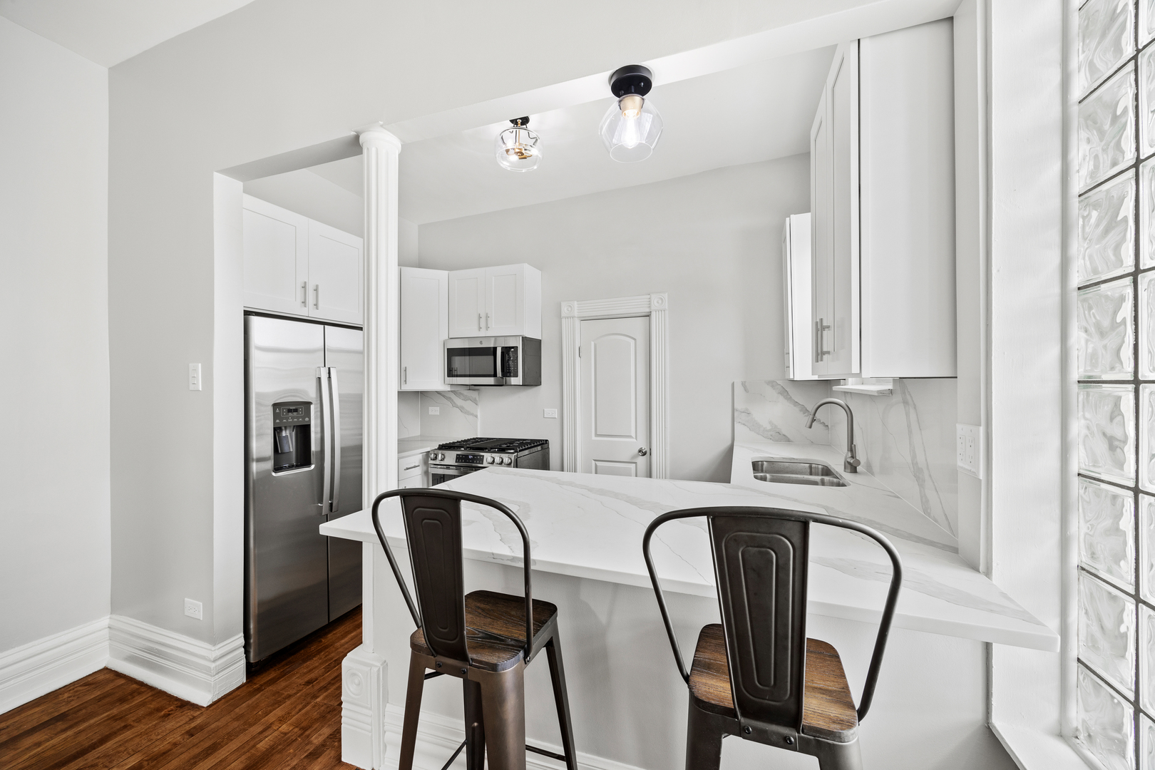 3214 West Division Street, Unit 2 Chicago, IL 60651 - Photo 4 of 14 a dining room with furniture and wooden floor