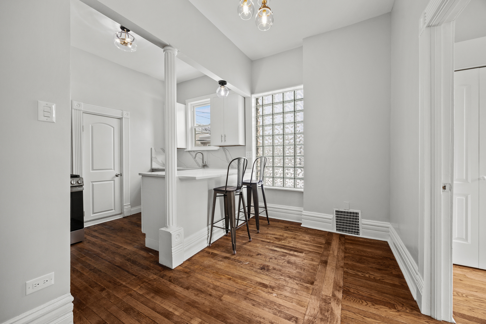 3214 West Division Street, Unit 2 Chicago, IL 60651 - Photo 5 of 14 a view of kitchen with furniture and wooden floor