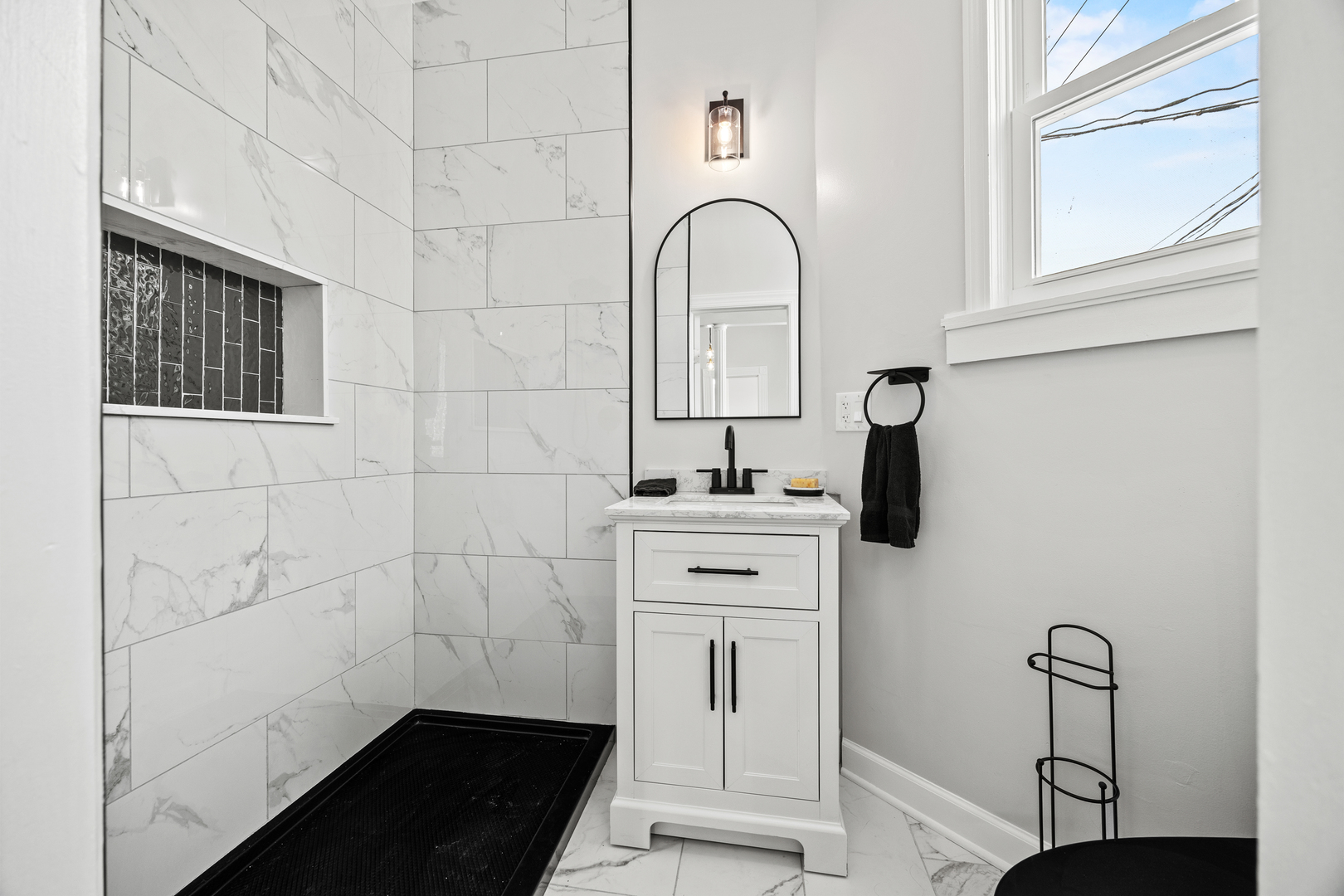 3214 West Division Street, Unit 2 Chicago, IL 60651 - Photo 6 of 14 a bathroom with a sink and a mirror