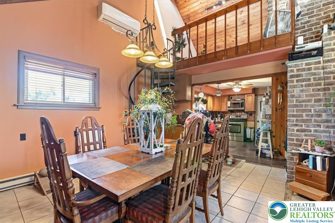 7567 Airport Road Bath, PA 18014 - Photo 17 of 67 a view of a dining room with furniture and chandelier