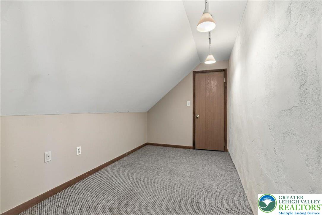 7567 Airport Road Bath, PA 18014 - Photo 41 of 67 a view of an empty room and a chandelier fan