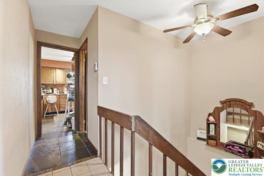 7567 Airport Road Bath, PA 18014 - Photo 43 of 67 a view of a hallway with wooden floor and workspace