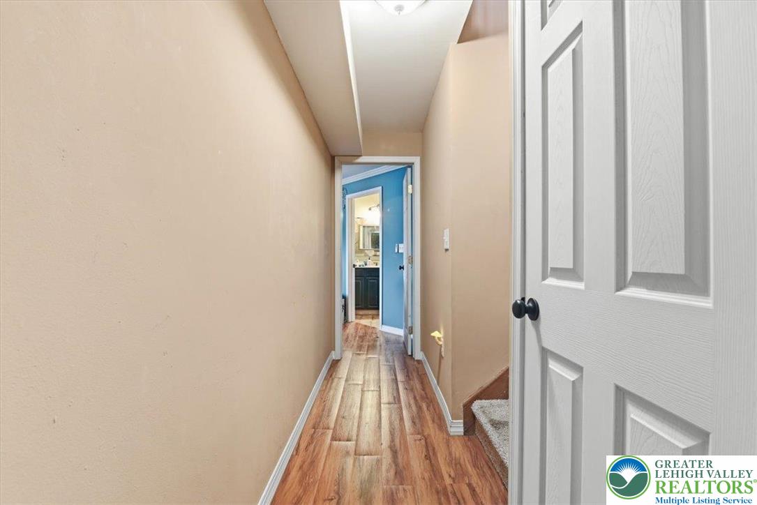7567 Airport Road Bath, PA 18014 - Photo 44 of 67 a view of a hallway with wooden floor and staircase
