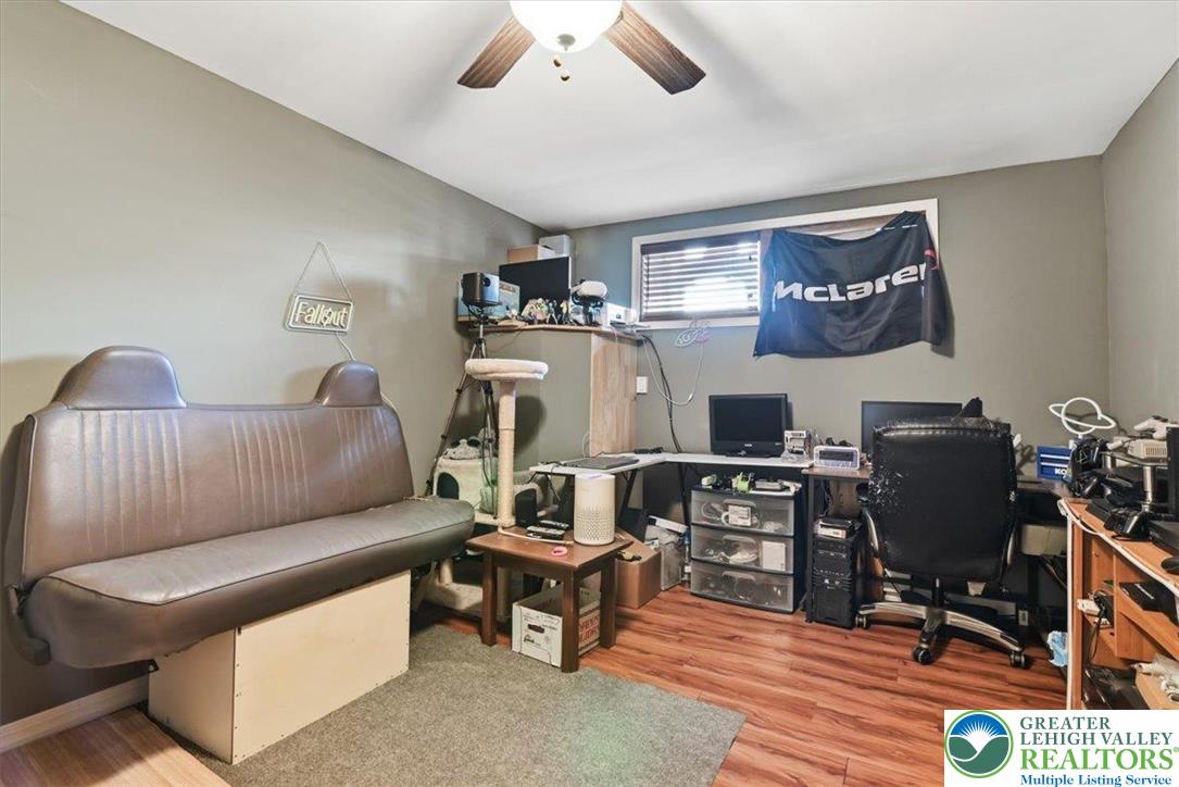7567 Airport Road Bath, PA 18014 - Photo 46 of 67 a living room with furniture and a flat screen tv