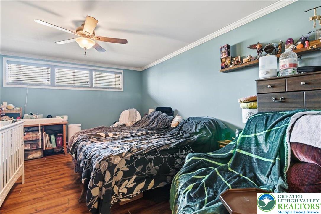 7567 Airport Road Bath, PA 18014 - Photo 51 of 67 a bed sitting in a bedroom next to a window