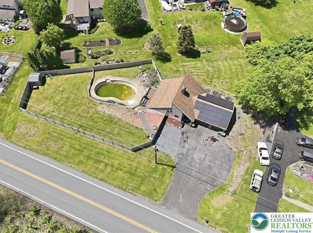 7567 Airport Road Bath, PA 18014 - Photo 64 of 67 an aerial view of a house with a swimming pool