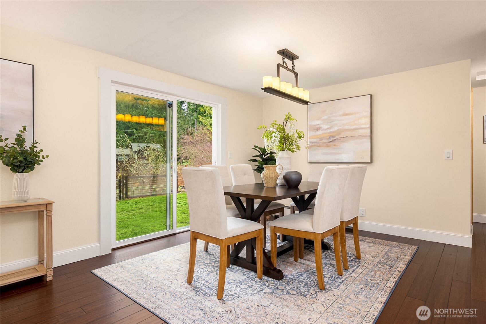 5808 Northeast Foster Road Bainbridge Island, WA 98110 - Photo 8 of 30 a view of a dining room with furniture window and wooden floor