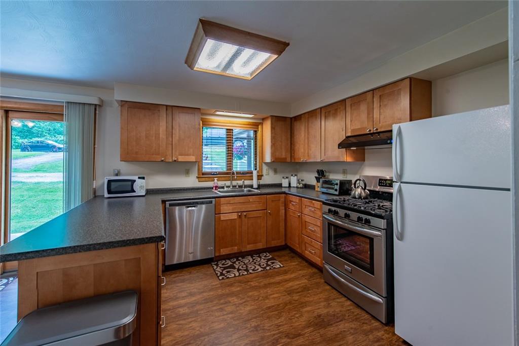 365 Boston Hollow Road Elizabeth, PA 15037 - Photo 10 of 25 Large kitchen that measures 20x11 with stainless steel dishwasher and stove. The kitchen offers a deep pantry.