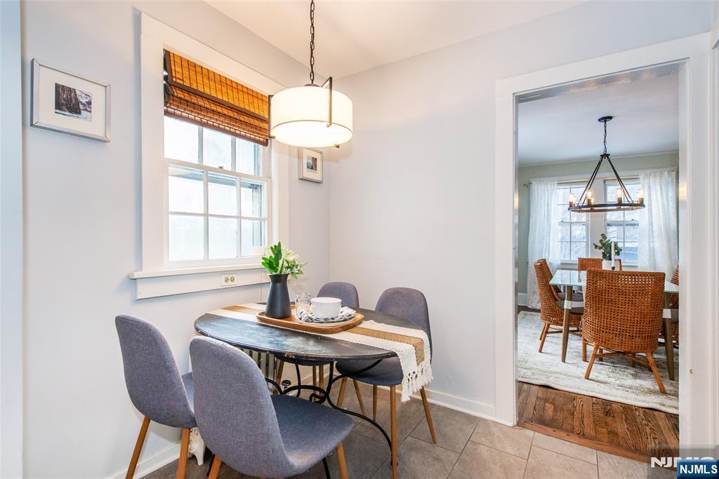 132 Mitchell Street West Orange, NJ 07052 - Photo 11 of 21 a dining room with furniture a chandelier and wooden floor