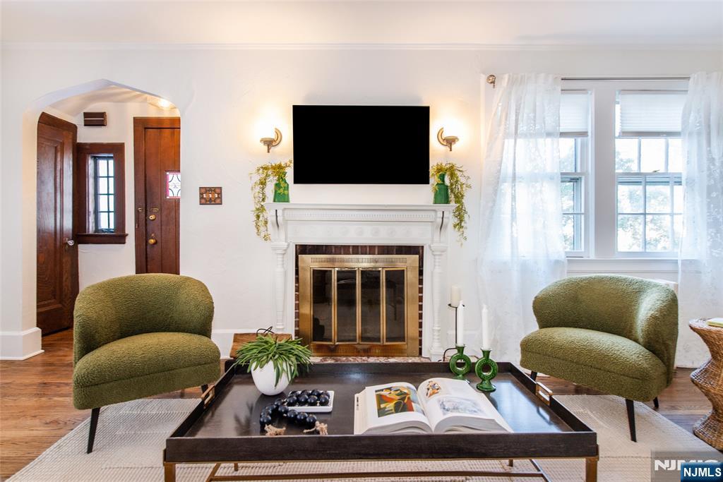 132 Mitchell Street West Orange, NJ 07052 - Photo 2 of 21 a living room with furniture fireplace and flat screen tv