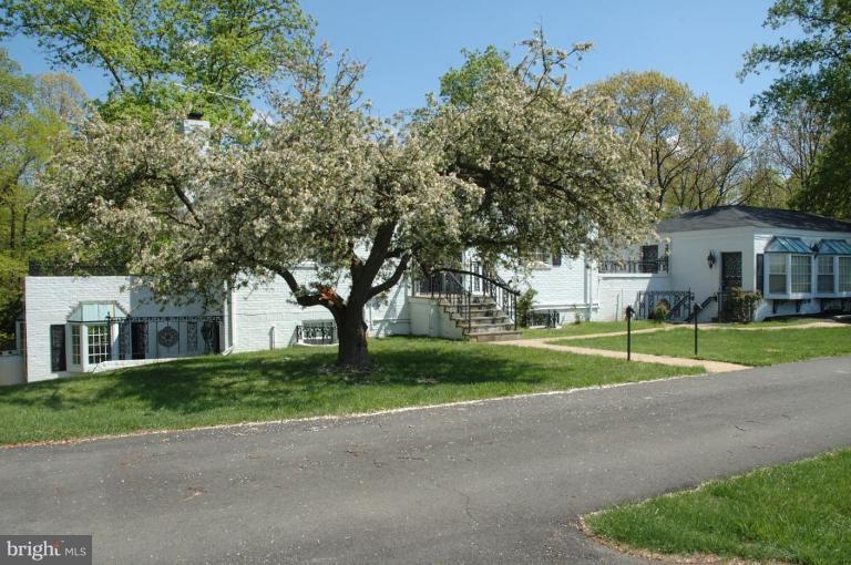 20166 Hogback Mountain Road Leesburg, VA 20175 - Photo 11 of 16 a view of a house with a big yard and large trees