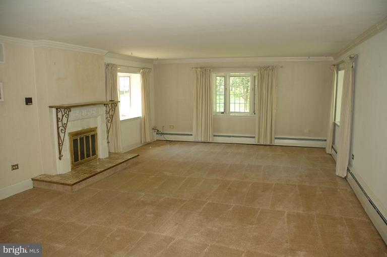 20166 Hogback Mountain Road Leesburg, VA 20175 - Photo 16 of 16 a view of an empty room with a fireplace and a window