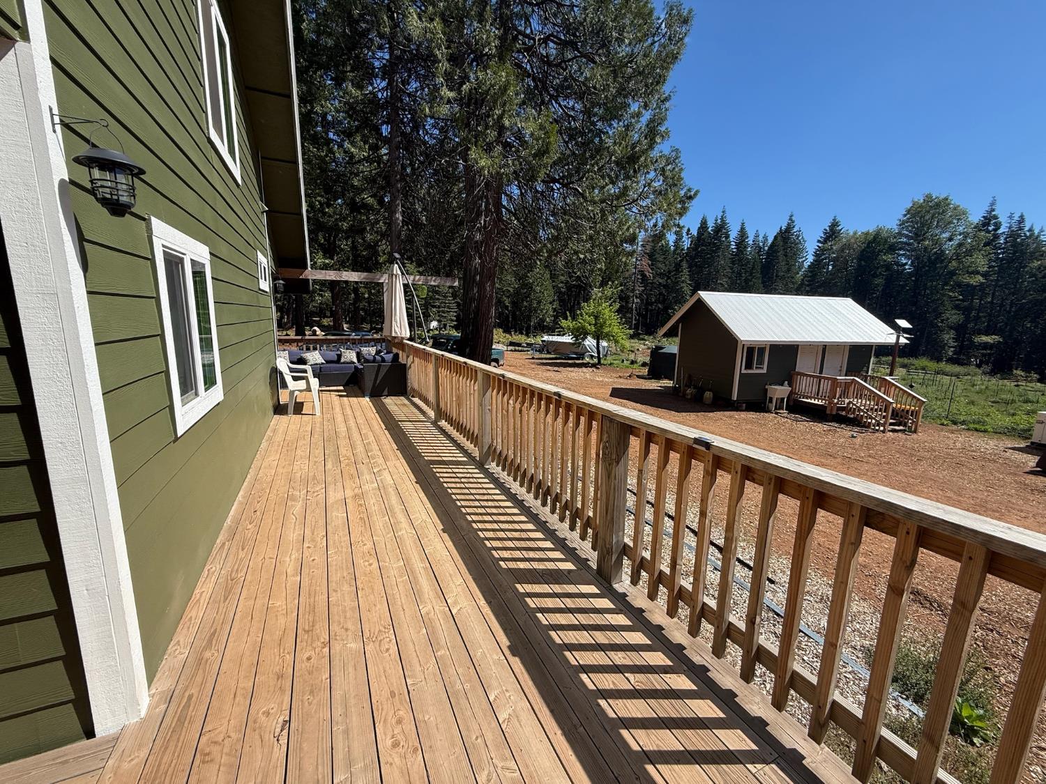 14940 Chalk Bluff Road Nevada City, CA 95959 - Photo 9 of 29 a view of balcony with wooden floor and outdoor seating