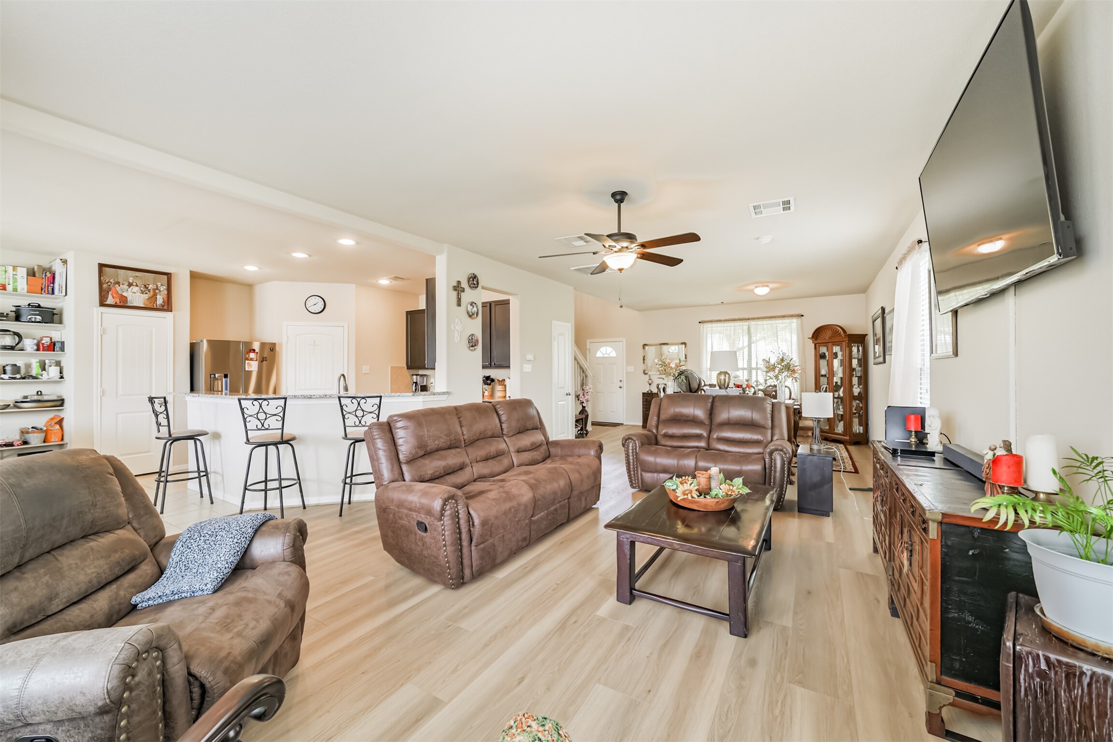 12009 La Salle River Road Conroe, TX 77304 - Photo 11 of 50 a living room with furniture and a wooden floor