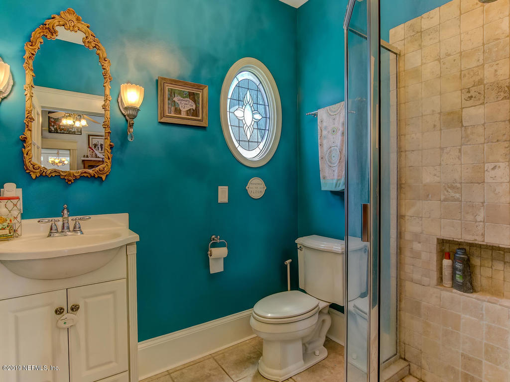 2230 Post Street Jacksonville, FL 32204 - Photo 11 of 34 a bathroom with a toilet a sink and a mirror
