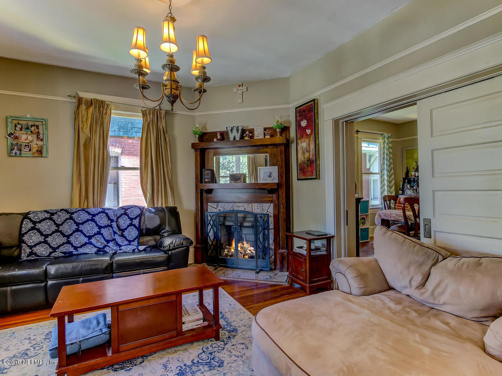 2230 Post Street Jacksonville, FL 32204 - Photo 13 of 34 a living room with fireplace furniture and a chandelier