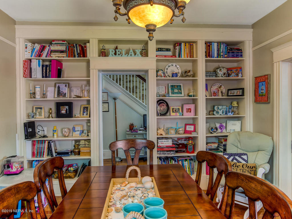 2230 Post Street Jacksonville, FL 32204 - Photo 15 of 34 a living room with furniture a book shelf and a shelf