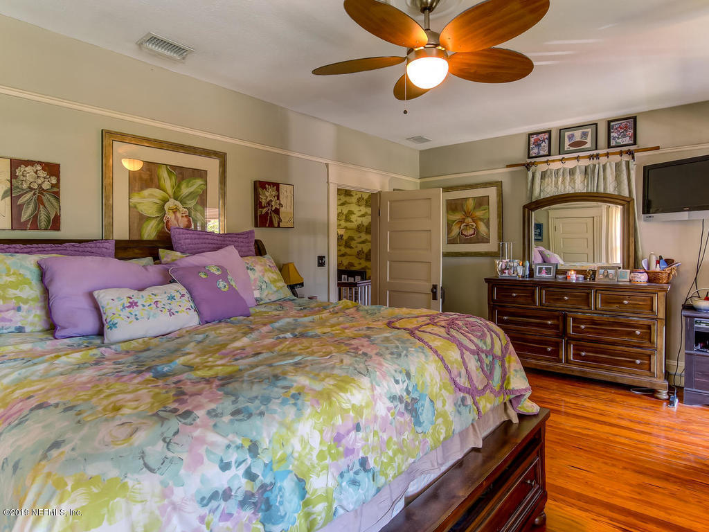 2230 Post Street Jacksonville, FL 32204 - Photo 24 of 34 a bedroom with a bed and wooden floor