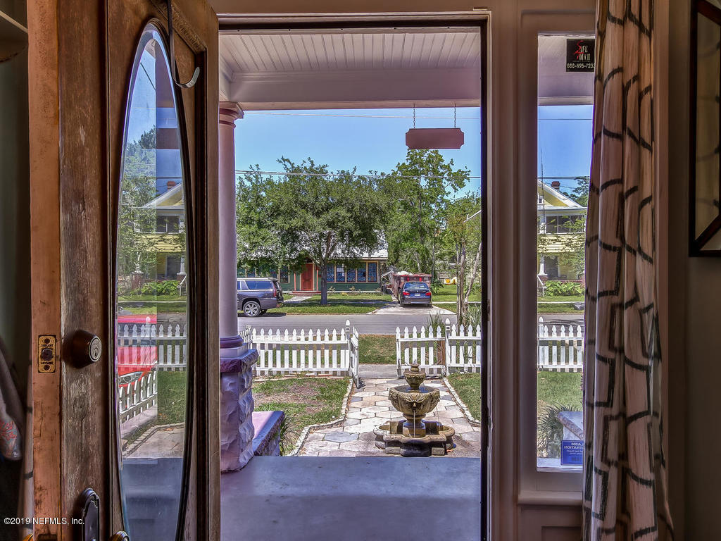 2230 Post Street Jacksonville, FL 32204 - Photo 5 of 34 a view of a porch with a furniture and floor to ceiling window