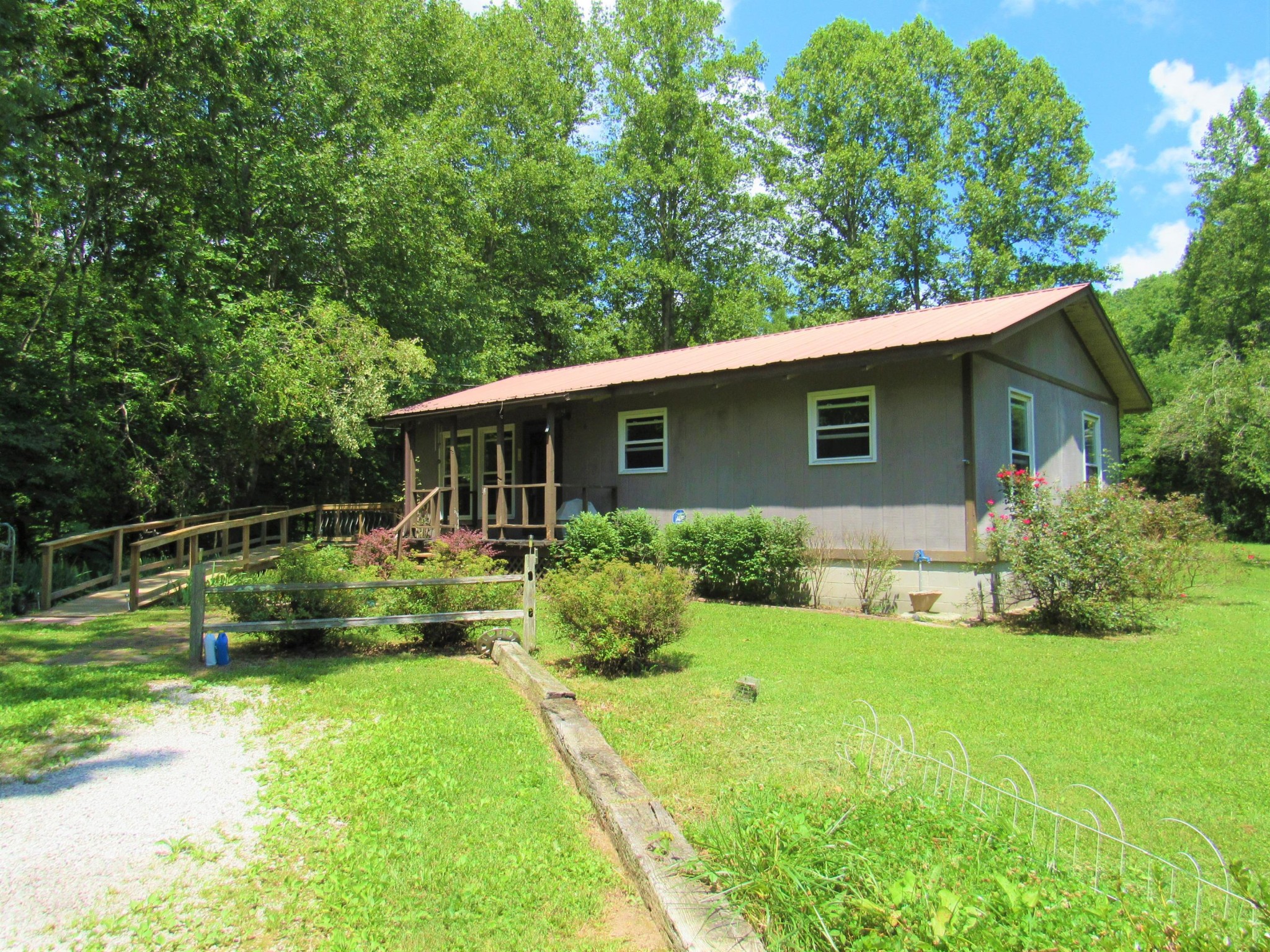 130 Frank Owens Road Lancing, TN 37770 - Photo 1 of 31 a view of house with backyard space and garden
