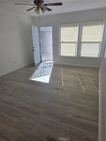 a view of an empty room with a window