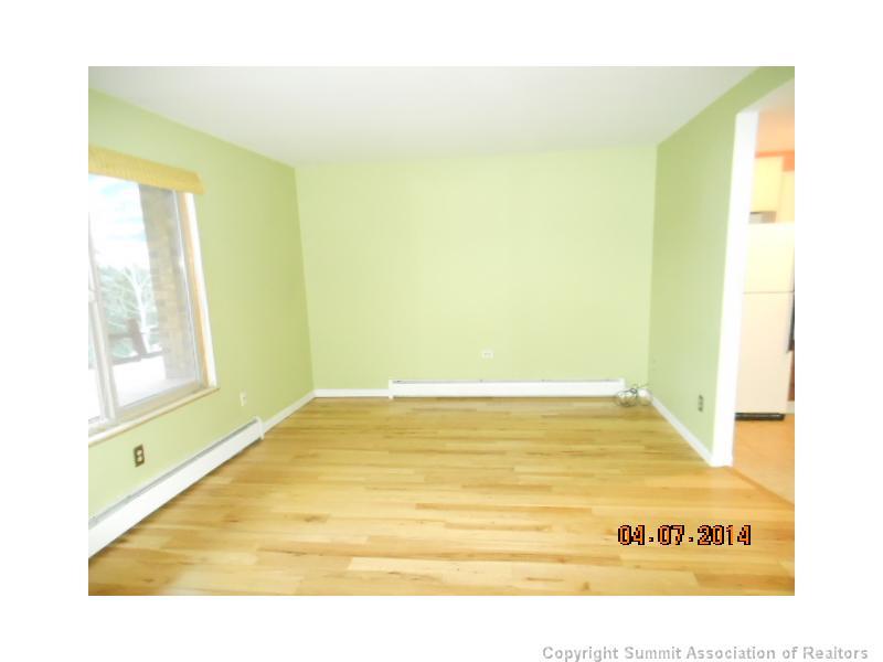 70 Evergreen Road, Unit A105 Dillon, CO 80435 - Photo 4 of 11 a view of an empty room with wooden floor
