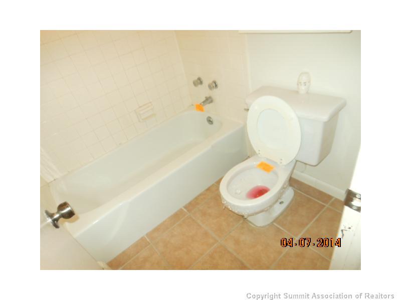 70 Evergreen Road, Unit A105 Dillon, CO 80435 - Photo 9 of 11 a bathroom with a sink mirror vanity and toilet