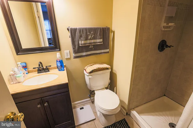 a bedroom with a bed and flat screen tv