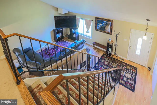 an empty room with a ceiling fan and a window