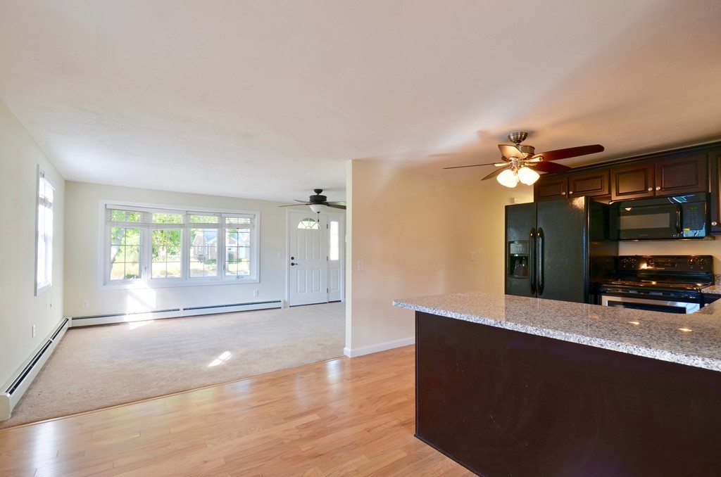 1117 Thompson Road Thompson, CT 06277 - Photo 11 of 20 an empty room with windows and fan