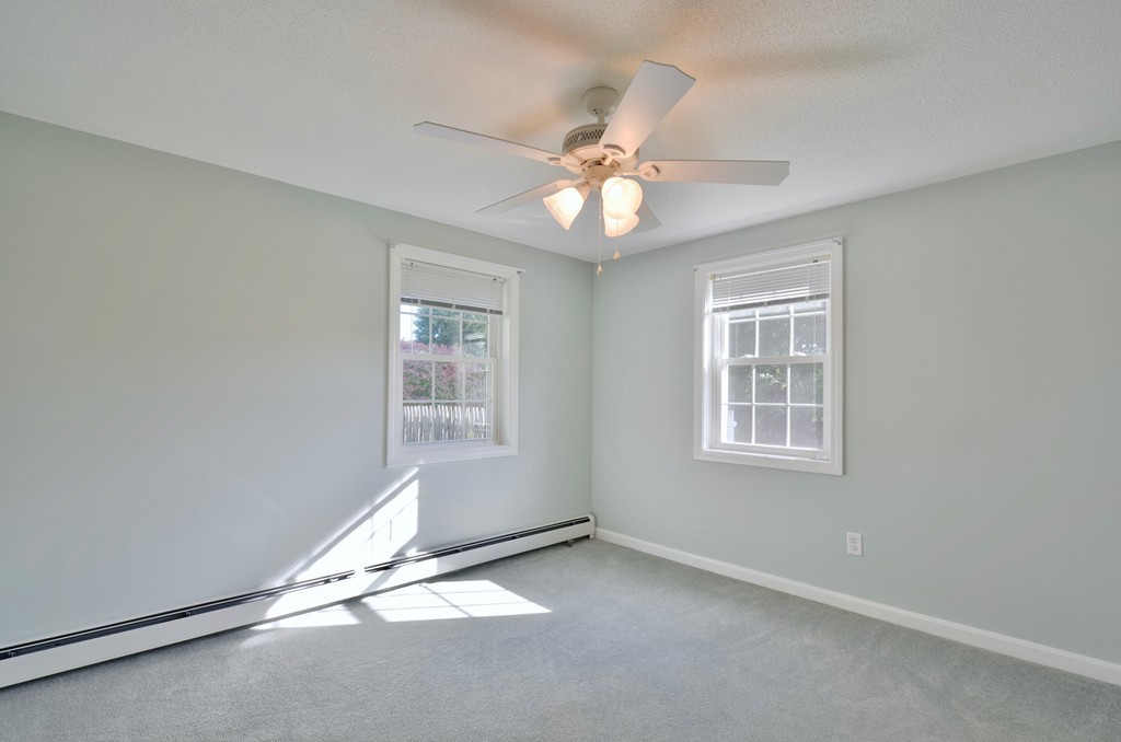 1117 Thompson Road Thompson, CT 06277 - Photo 16 of 20 an empty room with windows and fan