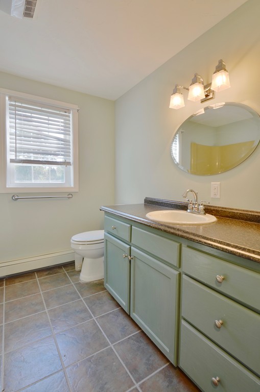 1117 Thompson Road Thompson, CT 06277 - Photo 18 of 20 a bathroom with a toilet sink and mirror