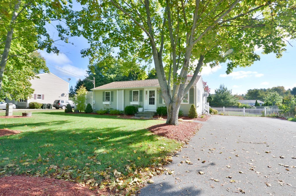 1117 Thompson Road Thompson, CT 06277 - Photo 2 of 20 a front view of a house with a yard and trees