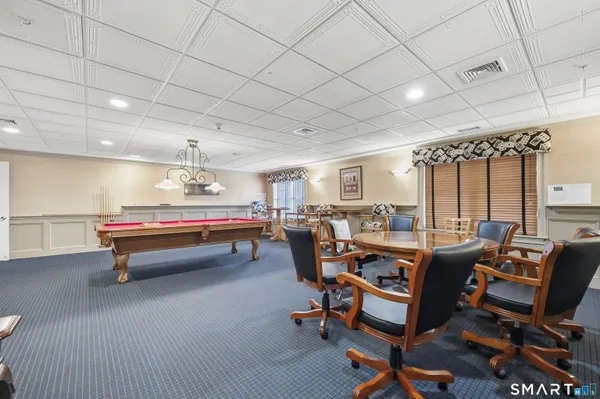 a workspace room with furniture