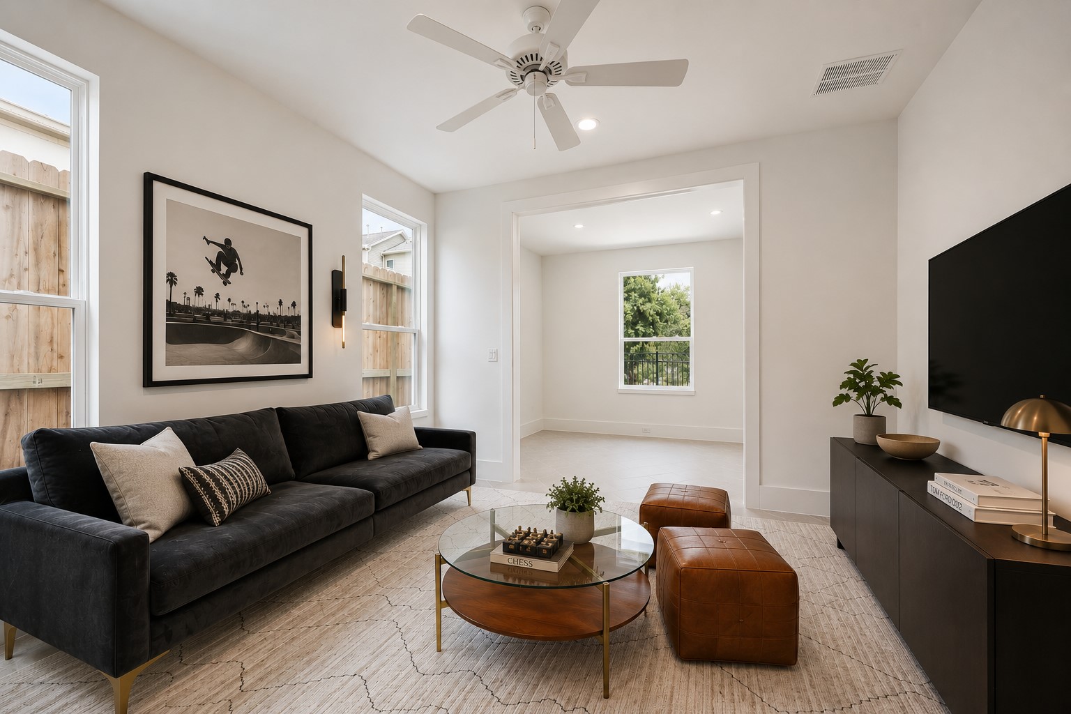 306 Fowler Street Houston, TX 77007 - Photo 22 of 29 A generously sized third bedroom. Currently staged as a game room/second living space — the perfect flexible secondary bed. A digitally enhanced image.