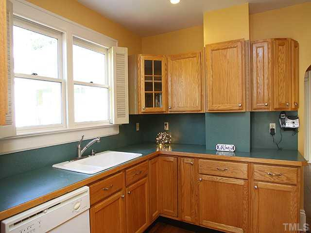 502 Harding Street Raleigh, NC 27604 - Photo 10 of 25 Wood trim edge countertops give these counters a step up. Kitchen is wired for corner tv. Kitchen