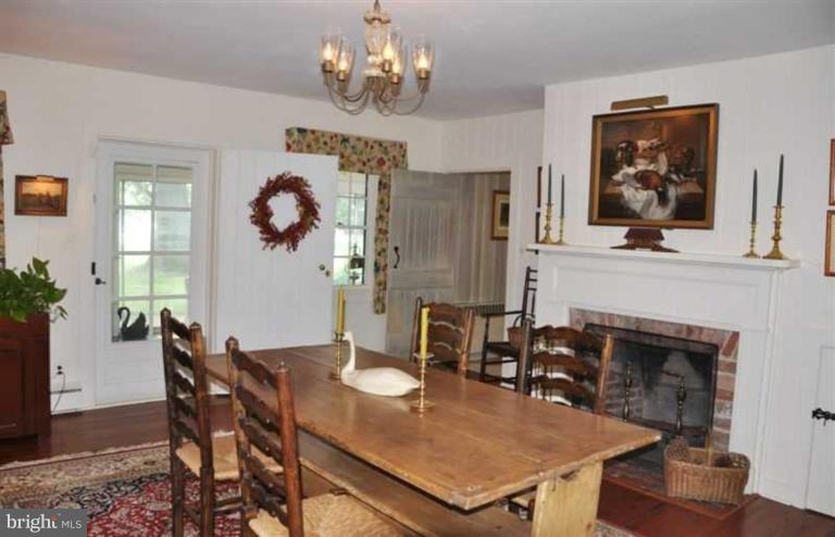 8469 Bozman Neavitt Road St. Michaels, MD 21663 - Photo 11 of 30 Dining Room With Fireplace