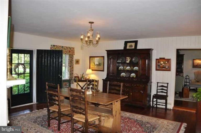 8469 Bozman Neavitt Road St. Michaels, MD 21663 - Photo 12 of 30 Dining Room With Heart Pine Floors & Fireplace