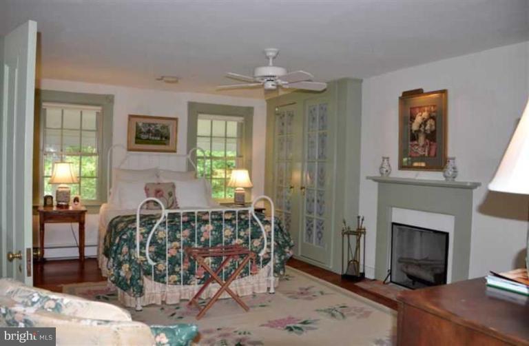 8469 Bozman Neavitt Road St. Michaels, MD 21663 - Photo 18 of 30 Bedroom With Fireplace, Sitting Room and Bath