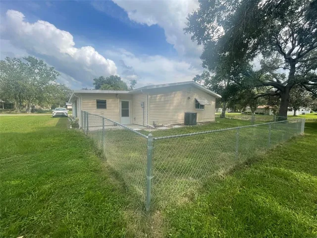 a view of a house with a big yard
