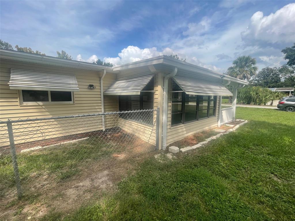 10028 Southwest 88th Terrace Ocala, FL 34481 - Photo 21 of 22 a view of a house with backyard